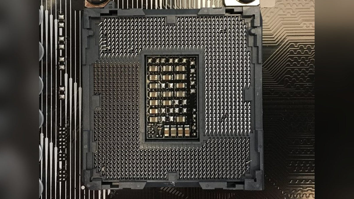Close-up of an empty Intel LGA CPU socket on a motherboard showing its rows of contact pins
