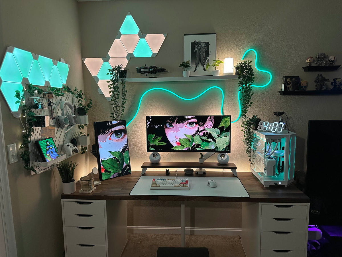 July setup contest winner desk with triangle wall lights, neon strip, two anime-art monitors, and a white glass PC