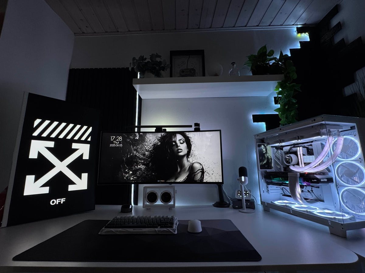 June setup contest winner desk with an ultrawide monitor, Off-White lightbox sign, and a white glass PC with RGB fans