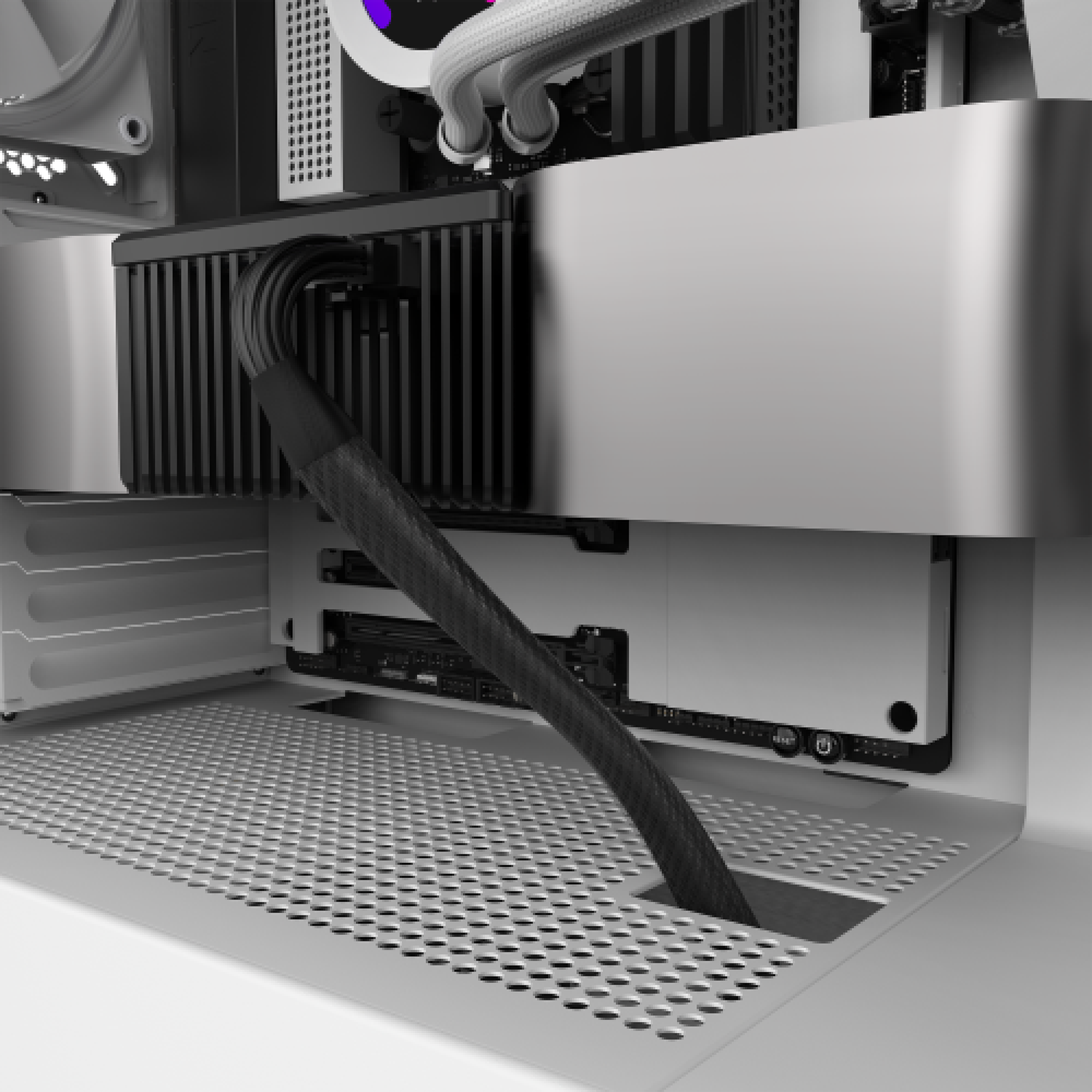 Close-up of a computer interior featuring an NZXT 12VHPWR Cable, black braided cables, an RTX 40 Series GPU, slotted metal case, cooling tubes, and tidy cable management connected to an NZXT C series PSU.
