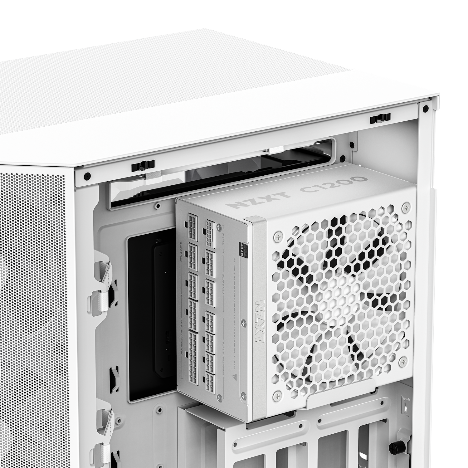 A close-up of a white computer case interior features an NZXT C1200 Gold ATX 3.1 PSU with a honeycomb-vented fan, labeled ports, and the side panel removed.