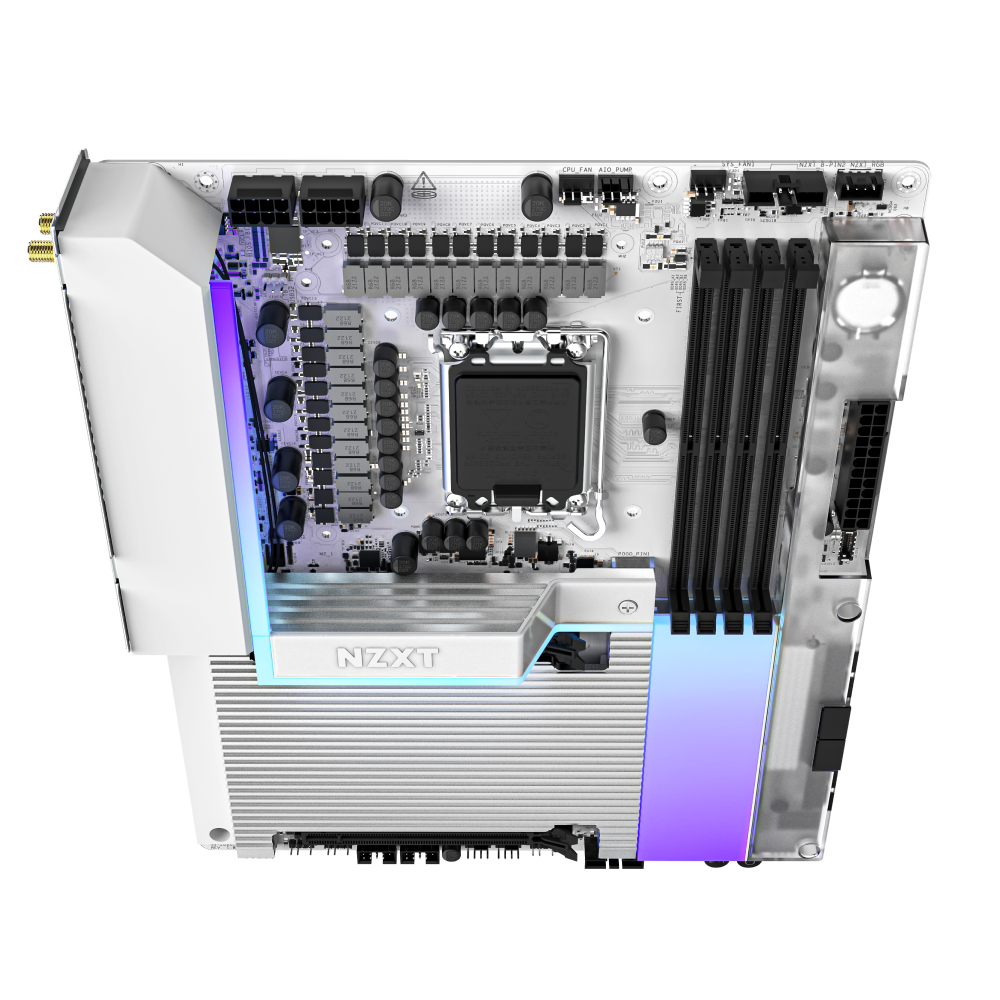 The NZXT N9 Z890 is a white motherboard with black and silver components, RAM slots, a CPU socket for Intel Core Ultra processors, heatsinks, and RGB lighting on the lower right—shown from a top-down view.