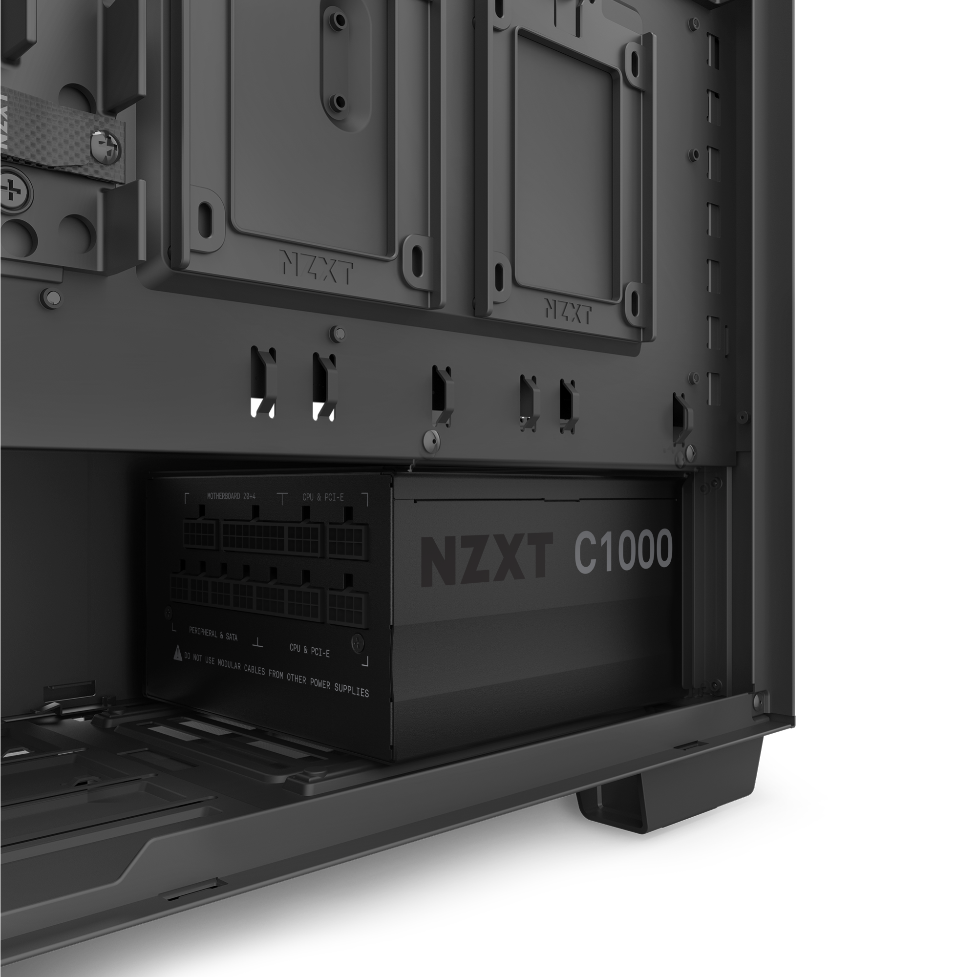 Close-up of a PC case interior with an NZXT C1000 Gold ATX 3.1 PSU installed at the bottom, showing cable ports and motherboard mount—perfect for next-gen NVIDIA GeForce RTX 50 Series GPU builds.