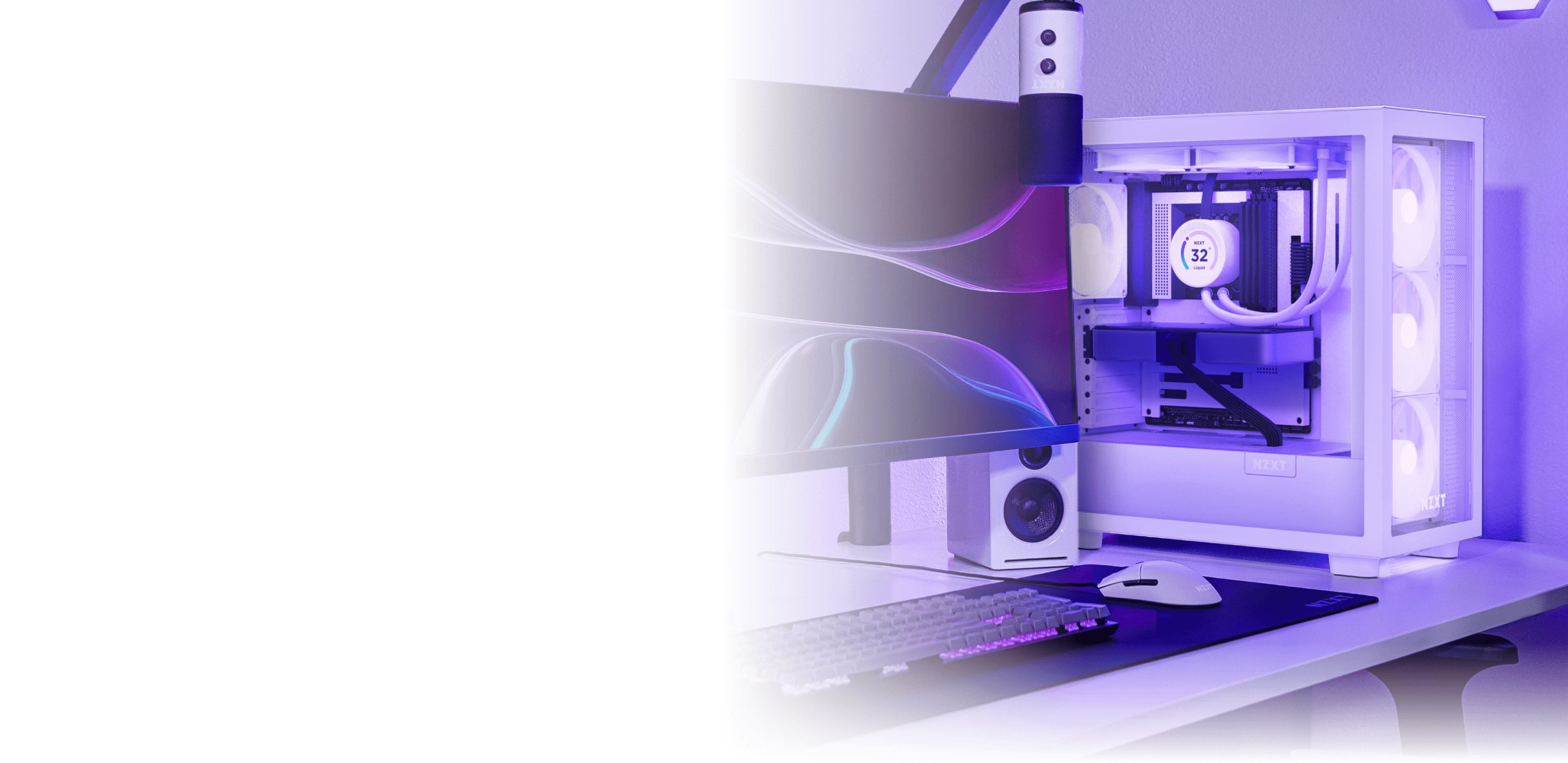 A modern gaming PC setup with a white desktop computer, curved monitor displaying abstract wavy lines, mechanical keyboard, mouse, speakers, and a microphone, all illuminated by purple LED lighting.