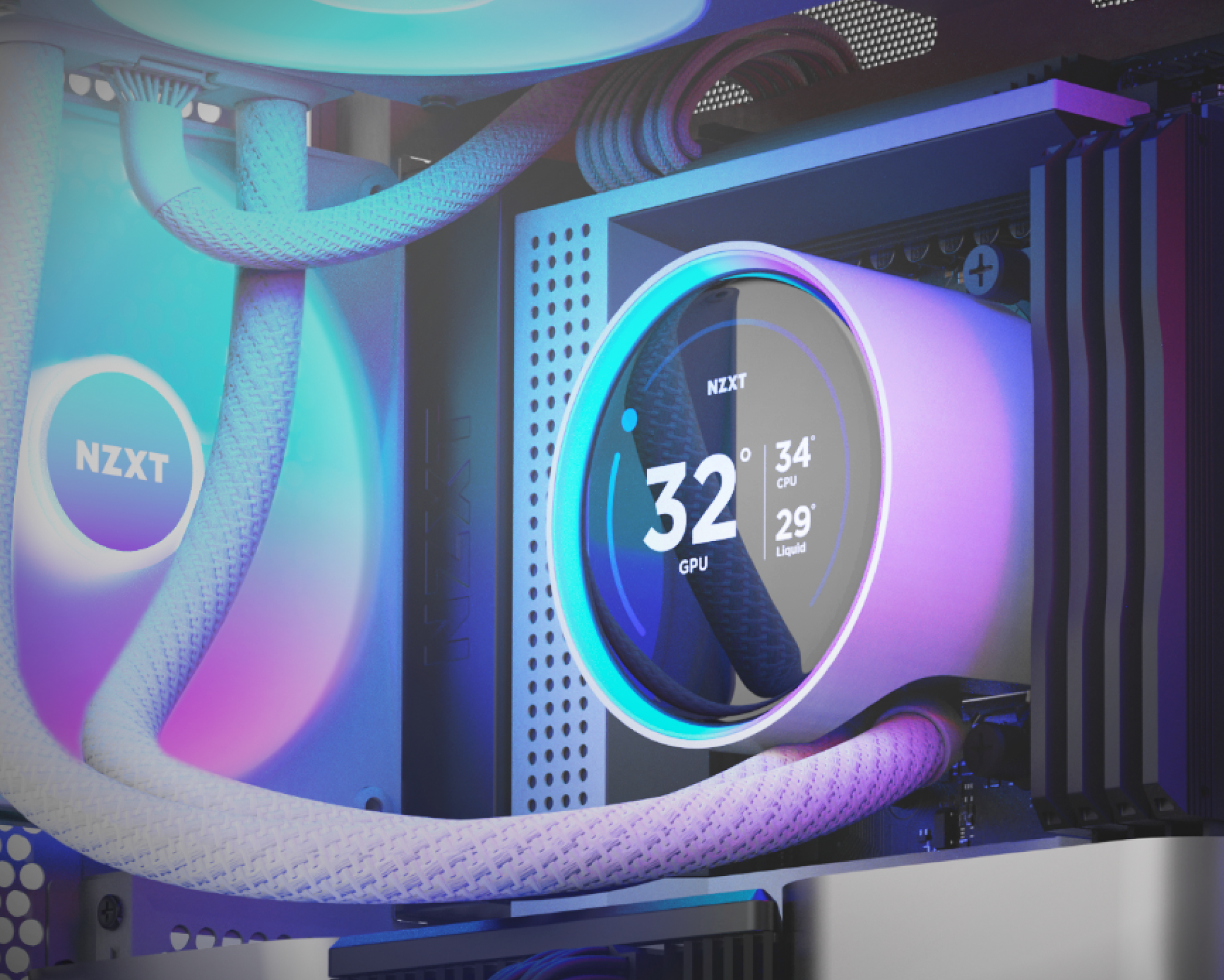 Close-up of a computer’s NZXT liquid cooling system with LED lights. The display shows GPU temperature at 32°C, CPU at 34°C, and liquid at 29°C, surrounded by white braided tubes.
